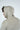 A man with brown hair wearing a Dark Khaki Deerfield Hoodie from Jaxson Maximus, renowned for its super soft cotton, looks to the side against a light background.