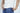 A man wearing the Jaxson Maximus Big League Notched V-Neck Short Sleeve White tee with blue pants.