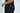 A person in a Big League Notched V-Neck Short Sleeve Black baseball tee with matching pants stands against a plain background. The tee includes a stylish notch neckline and JM initials by the hem, adding personalized flair.