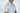 A person is wearing the West Palm Polo: White With Navy Stripes, made from luxury performance fabric. Against a plain white background, the focus is on the upper half with a bespoke English spread collar and short sleeves. The persons face is partially visible.