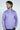 A man with brown hair and a beard wears a vibrant Key West 1/4 Zip: Golf Cart Palm pullover, displaying a geometric design. He looks thoughtfully sideways with one hand in his pocket, while the plain white background accentuates his stylish outfit available in multiple sizes.